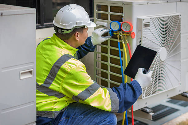 Professional Air Duct Cleaning technician working in Ferguson, MO